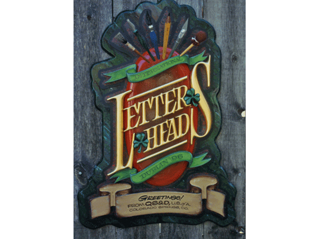 Gilded, hand-carved letters