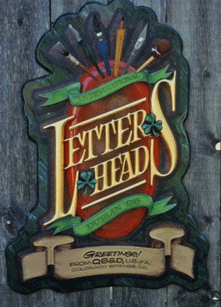 Hand carved, gold leaf sign