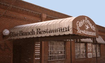 Storefront awning hand lettered on site