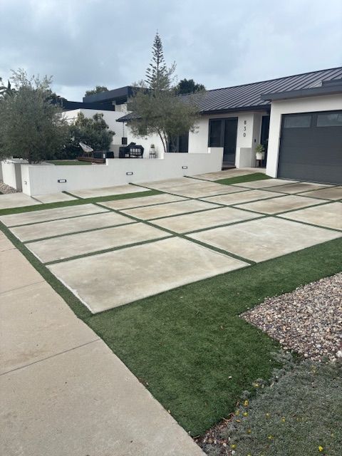 A house with a large driveway and a garage