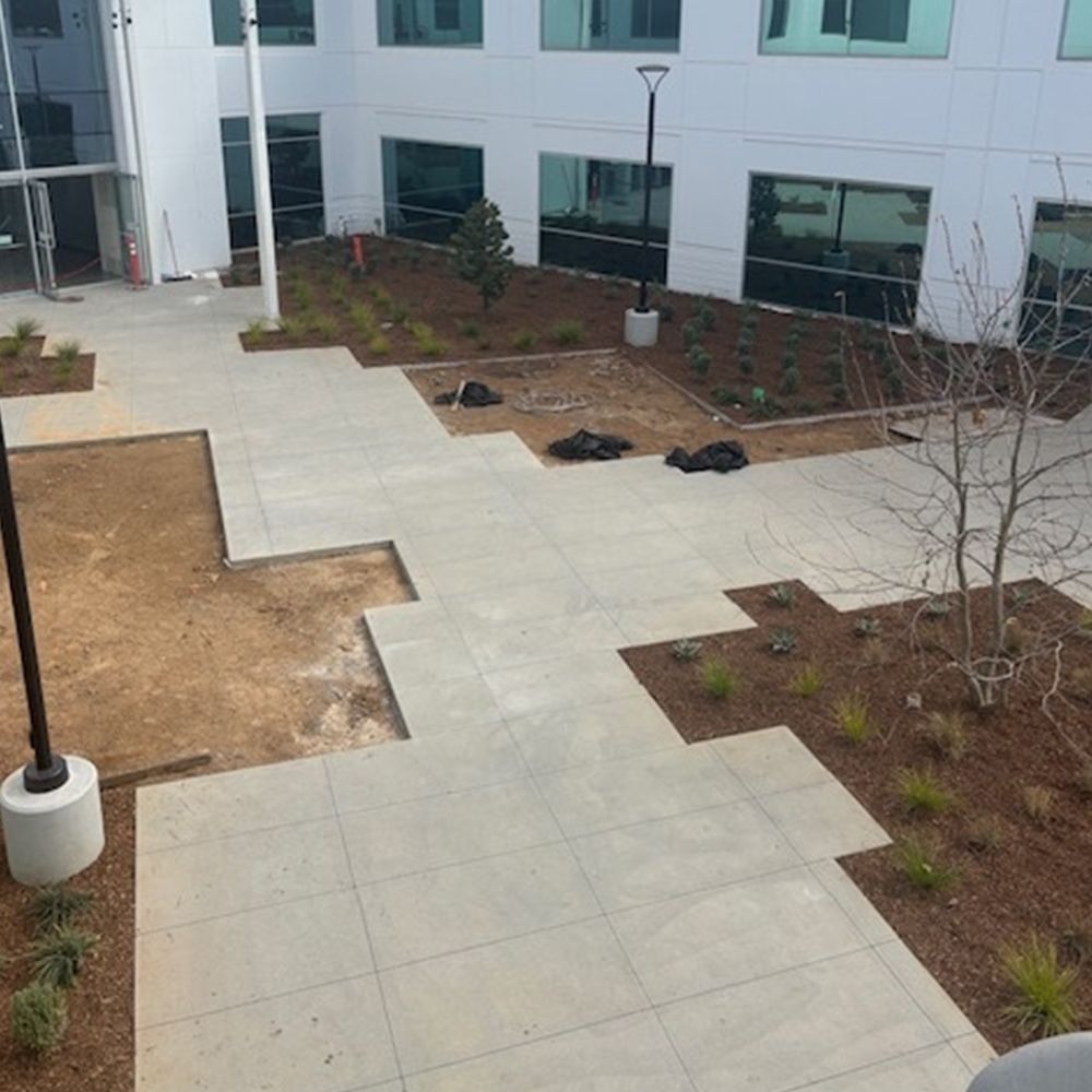 A large building with a patio in front of it