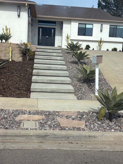 A house with stairs leading up to the front door