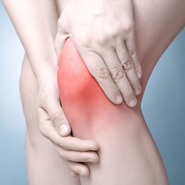 Woman with Inflammation experiencing pain in her knees