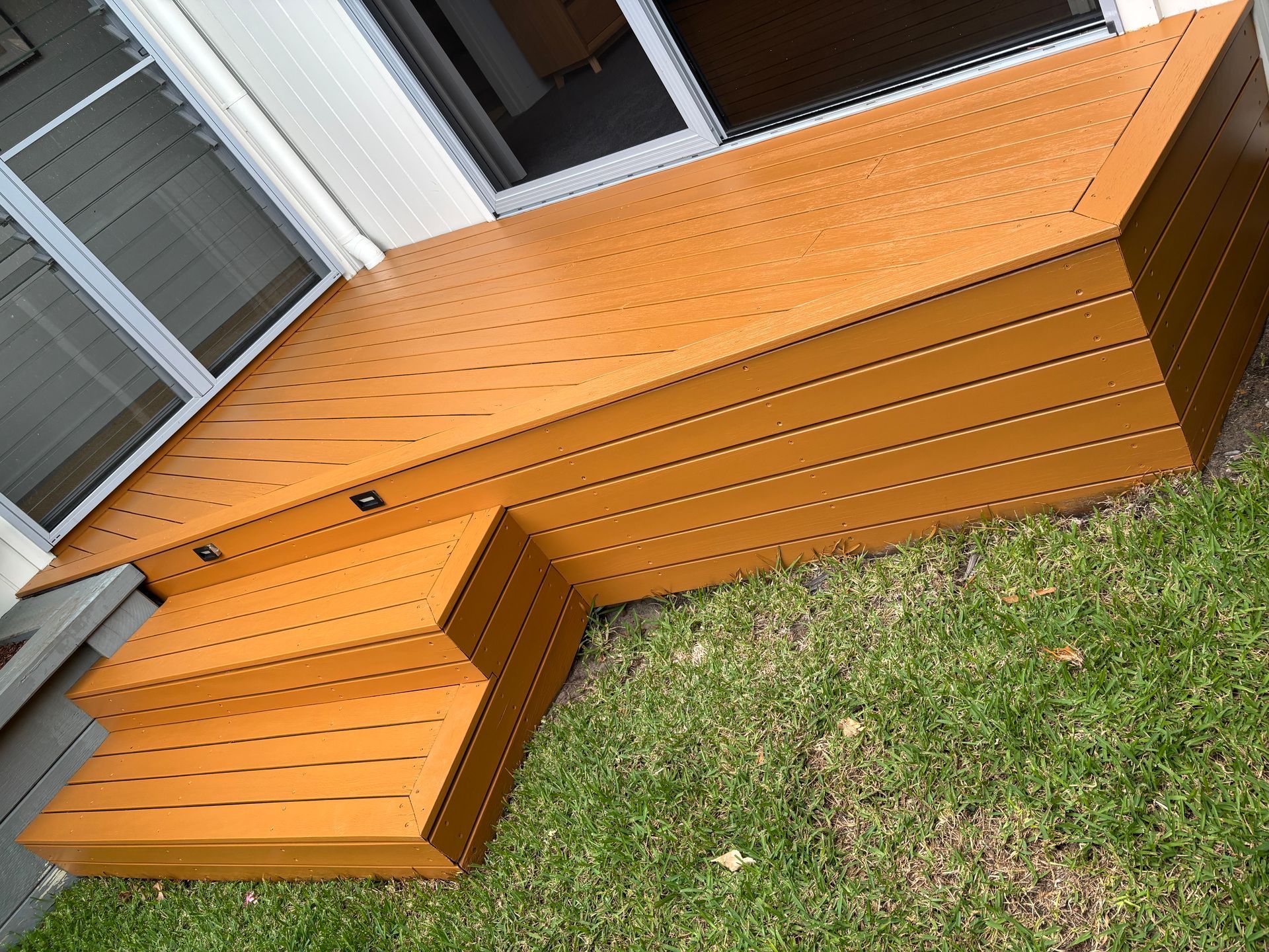 A wooden deck with stairs leading up to it — Timeless Painting In Umina Beach, NSW