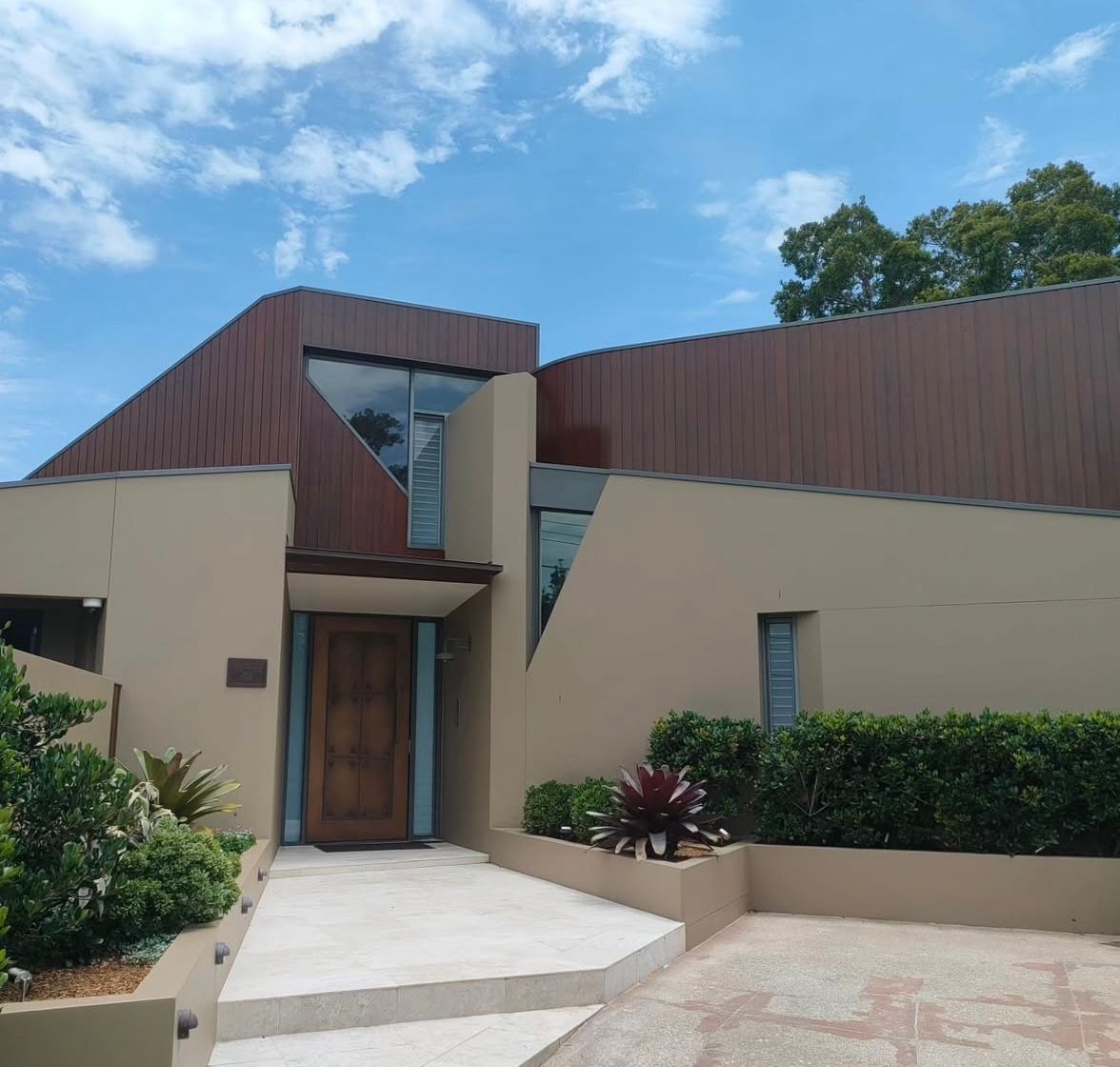 The front of a house with a wooden door — Timeless Painting In Umina Beach, NSW