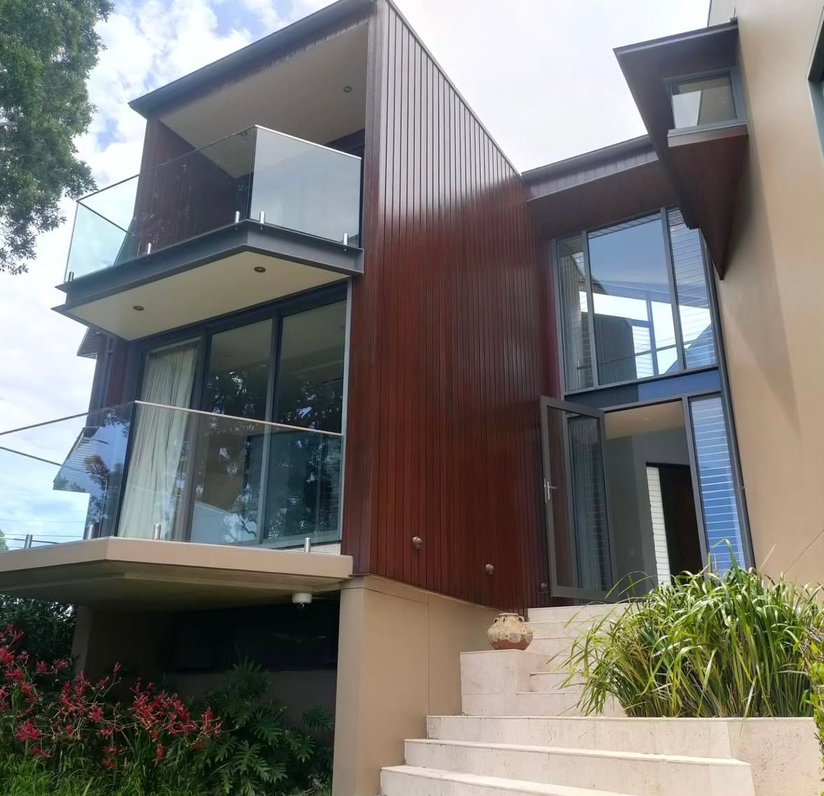 A large house with stairs leading up to it — Timeless Painting In Umina Beach, NSW