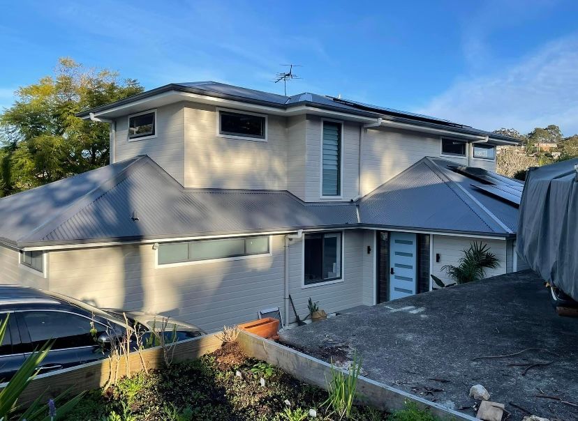 A large house with a grey roof and a car parked in front of it — Timeless Painting In Umina Beach, NSW