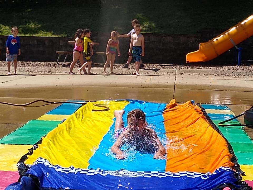 A Boy Having Fun on Water Slide — St. Louis, MO — Sappington Child Care Center & Summer Day Camp