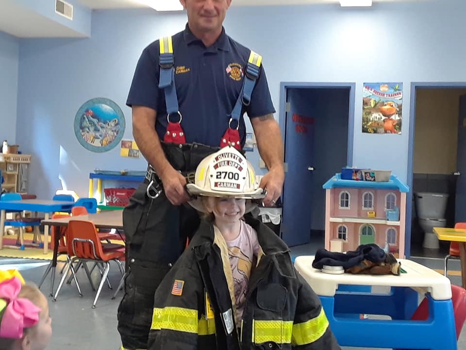 Kid Wearing The Fireman Uniform — St. Louis, MO — Sappington Child Care Center & Summer Day Camp