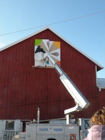 Placing Signage on Red House — Shawano, WI — Raddant Electric Service Inc