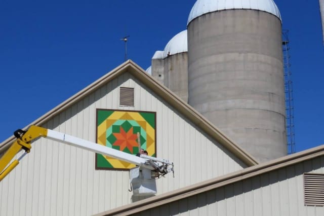 Working on Industrial Warehouse Signage — Shawano, WI — Raddant Electric Service Inc