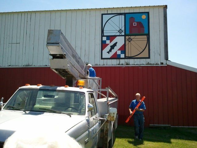 Cherry Picker Truck Near Barn — Shawano, WI — Raddant Electric Service Inc