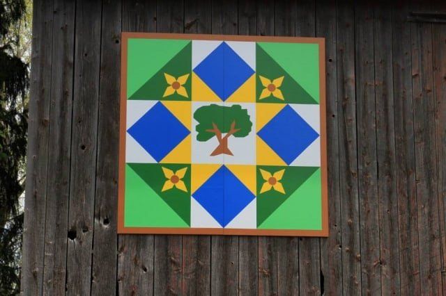 Signage With Tree Design on Wood — Shawano, WI — Raddant Electric Service Inc