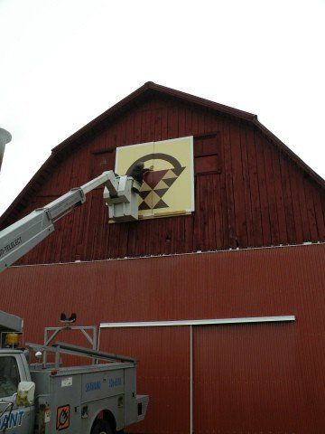 Men Working on Signage on Barn — Shawano, WI — Raddant Electric Service Inc