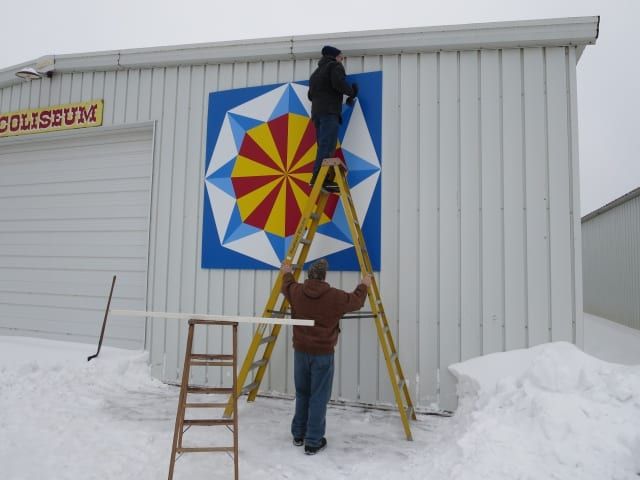 Working on Signage With Thick Snow — Shawano, WI — Raddant Electric Service Inc