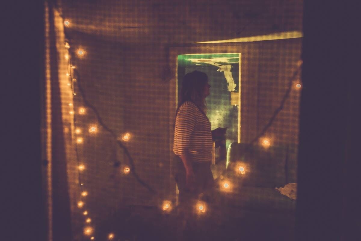 Woman Inside A Room Surrounded By Lights – Dallas, TX – Artstillery