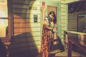 Woman standing In front Of A HOs PIISL– Dallas, TX – Artstillery