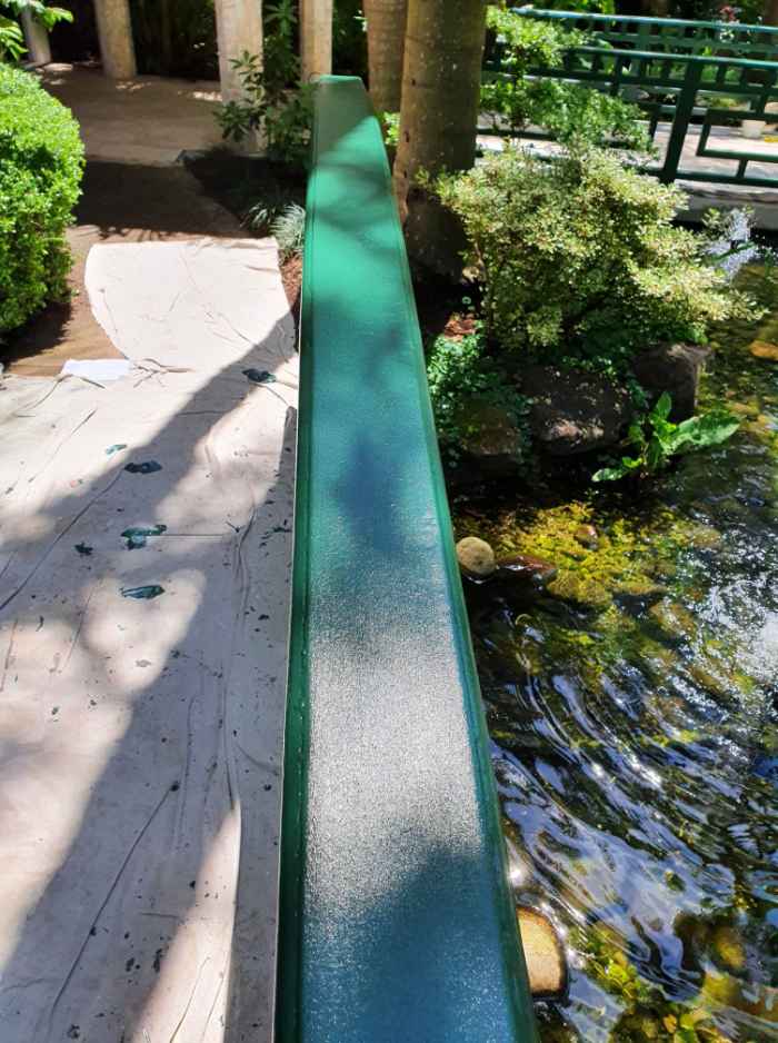 view of a pond next to a bridge