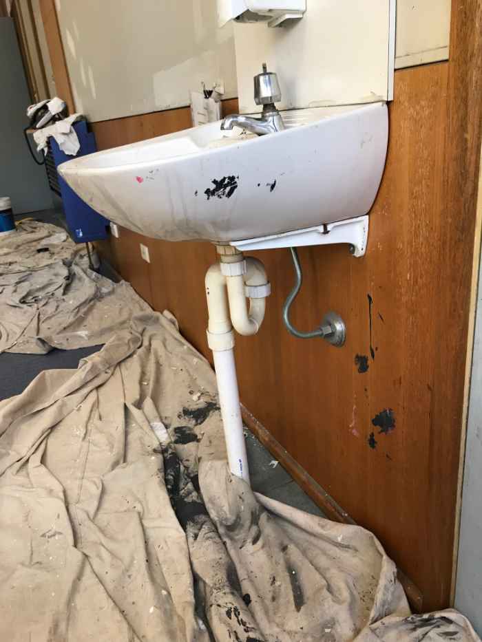 view of a washbasin and installed pipe