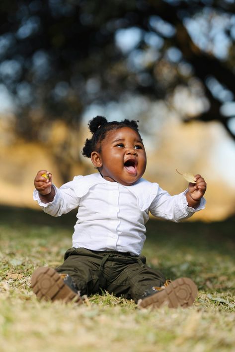 Baby smiling in park
