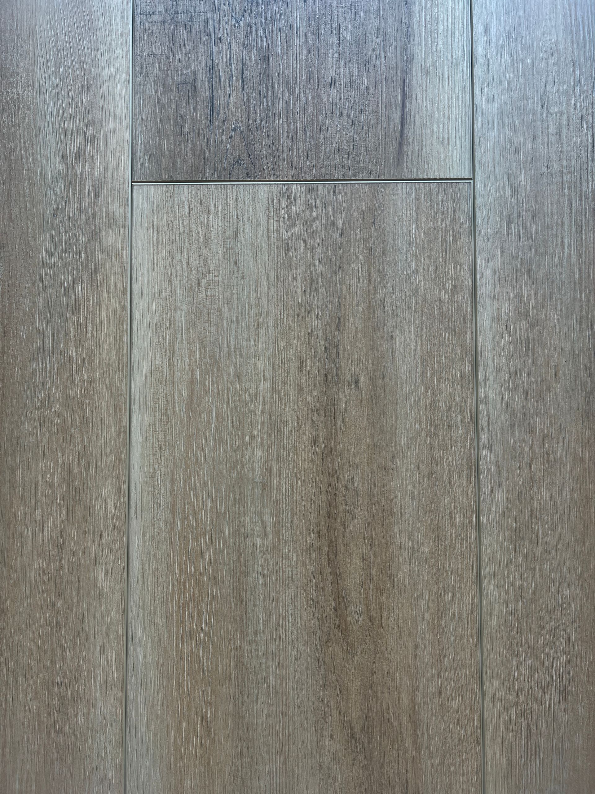 Close-up of wooden floor tiles in shades of brown and gray.
