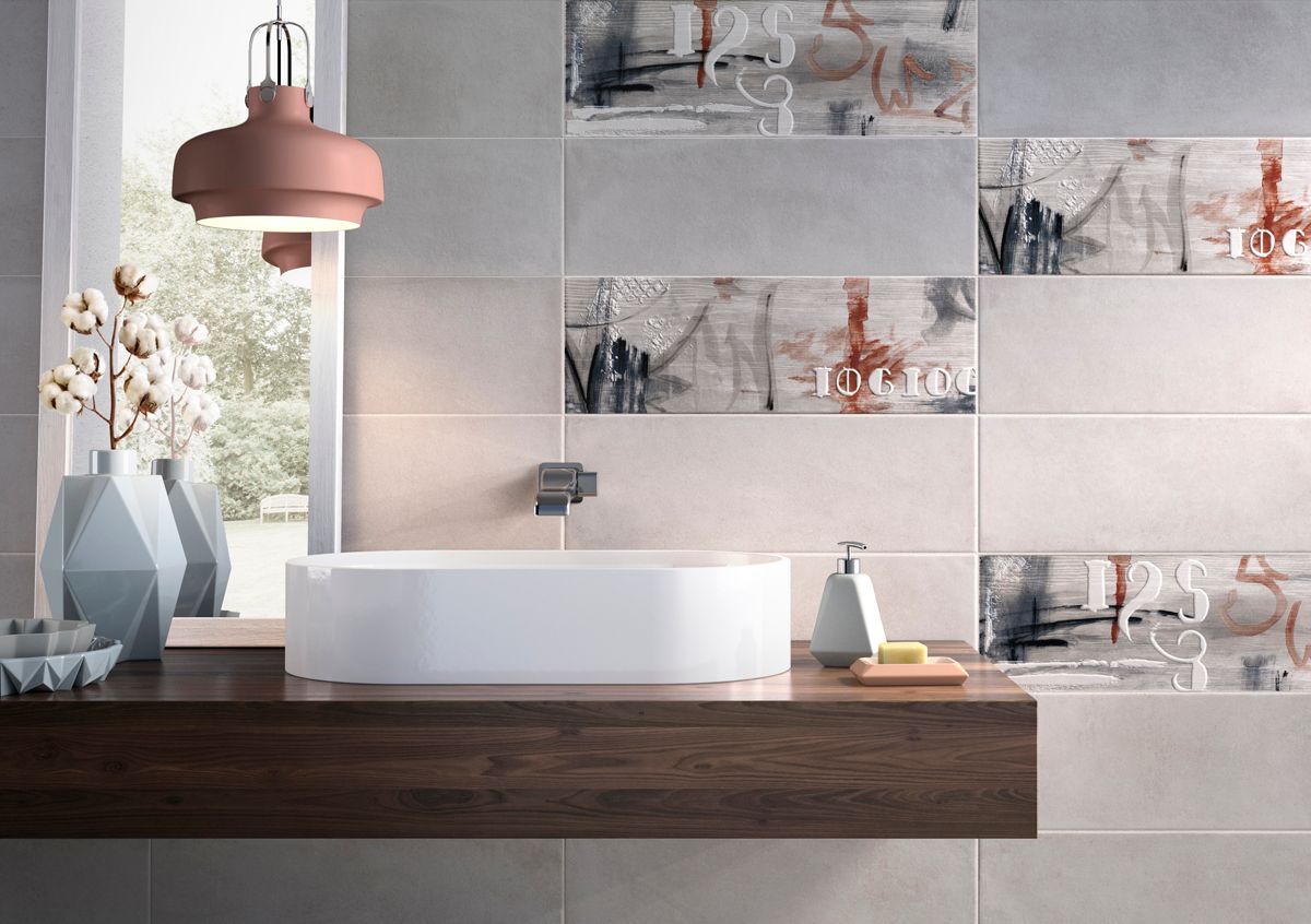 A bathroom with a sink and a window.