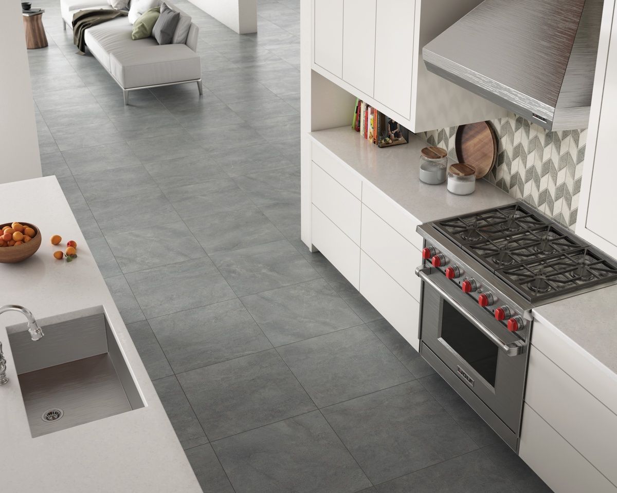 A kitchen with a stove top oven and a sink