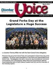 A group of people are sitting in a stadium on the cover of a magazine.