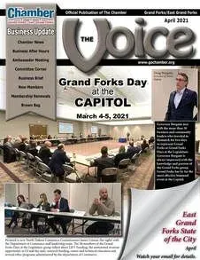 The cover of the chamber of commerce 's business update magazine shows a group of people sitting at tables.
