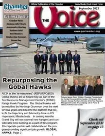 A group of people are on the cover of a magazine called the voice