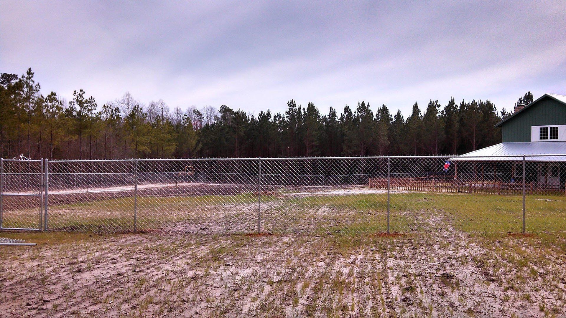 Green House With Fence — Wilmington,  NC — J & J Fence