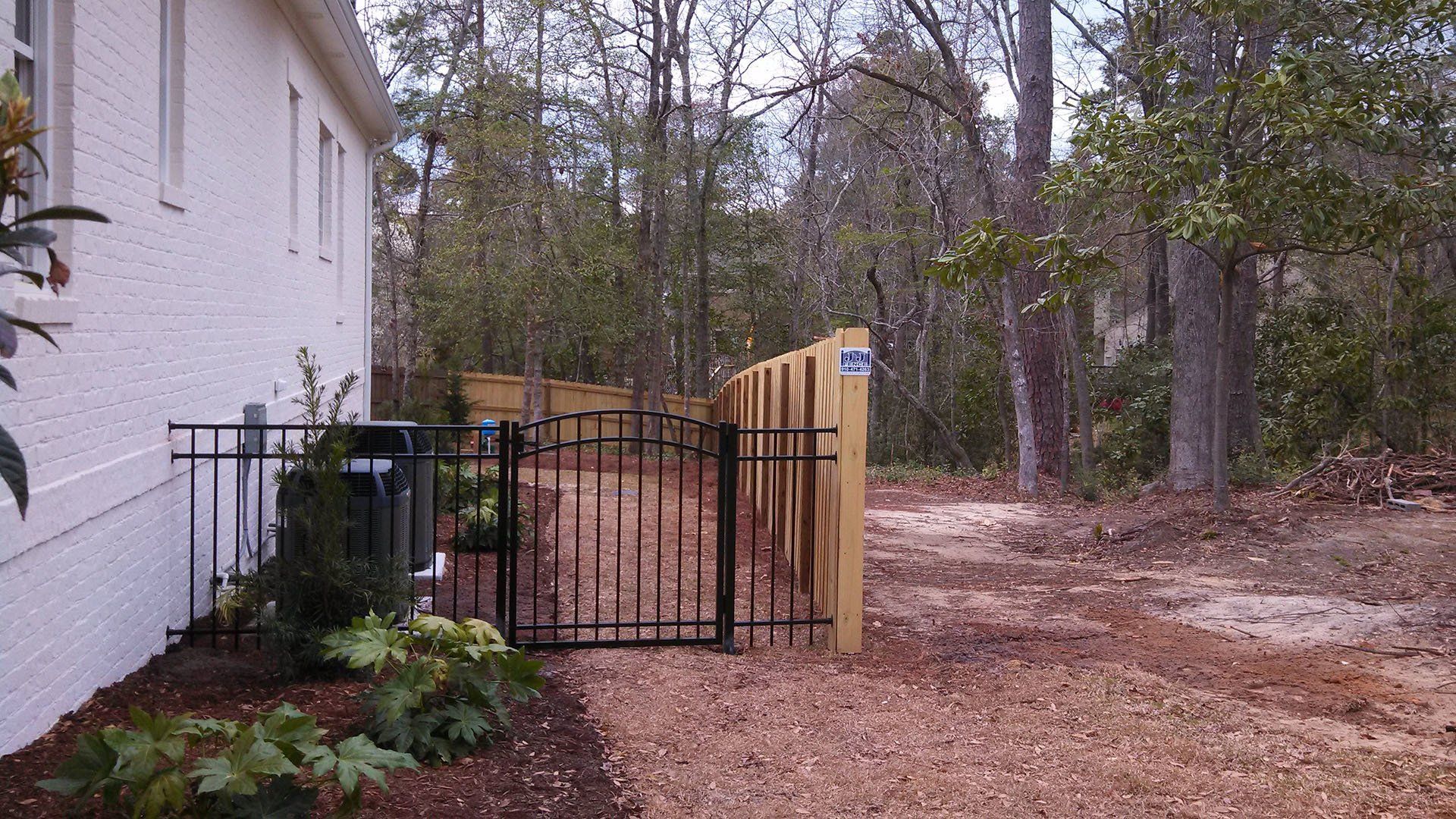 Metal And Wood Fence — Wilmington,  NC — J & J Fence