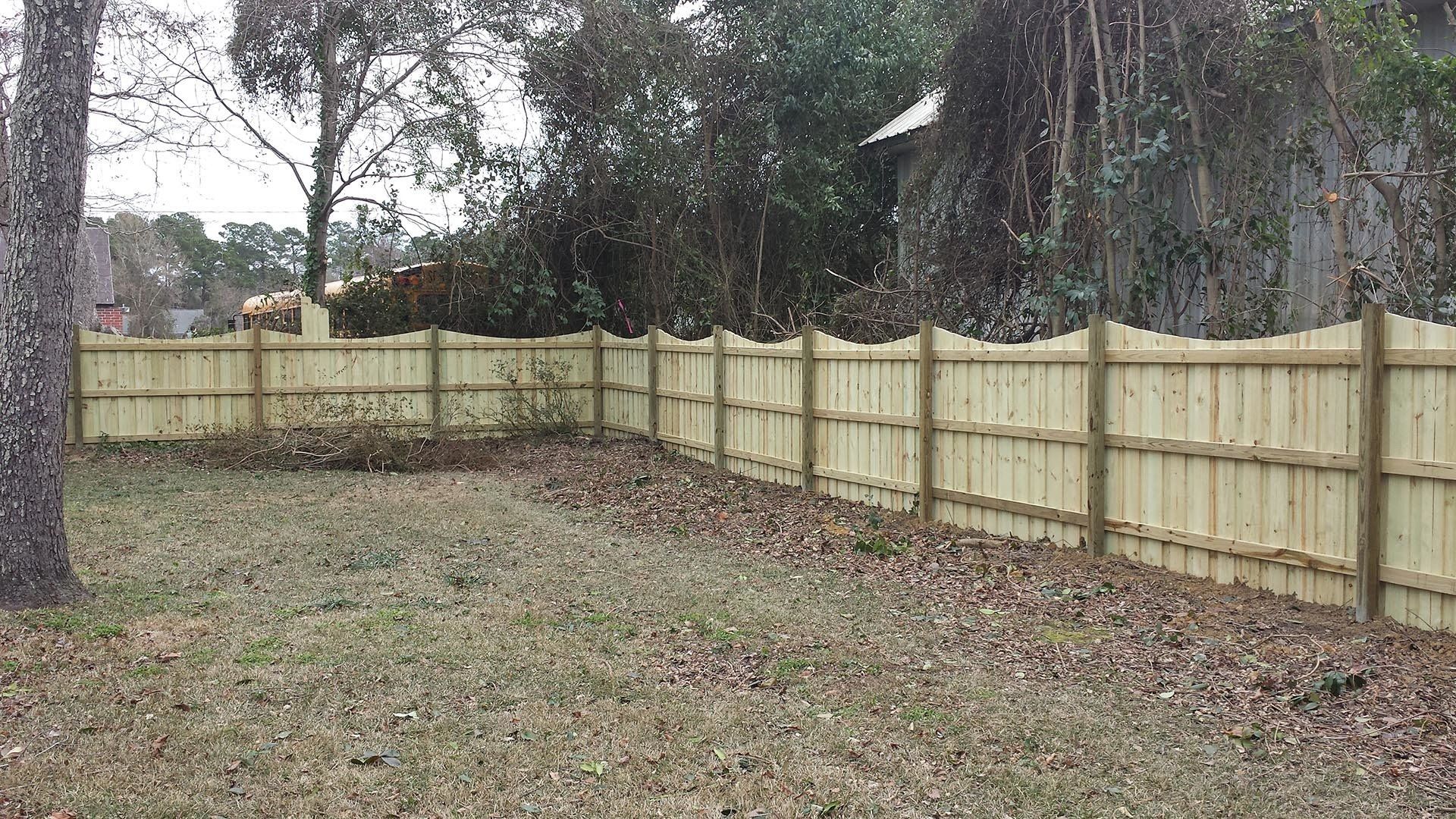Wooden Fence With Curve Design — Wilmington,  NC — J & J Fence