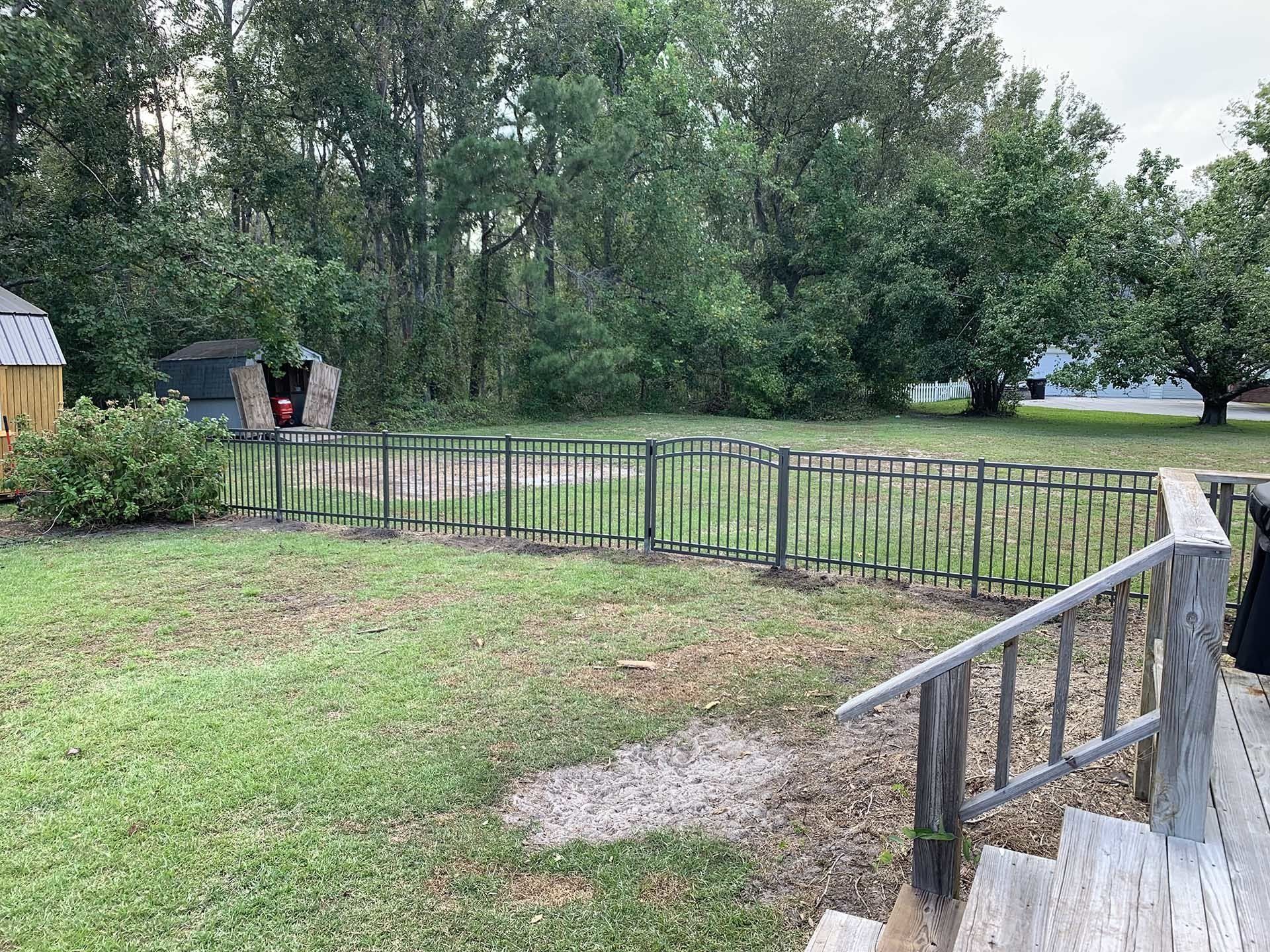 Gray Backyard Fence — Wilmington,  NC — J & J Fence