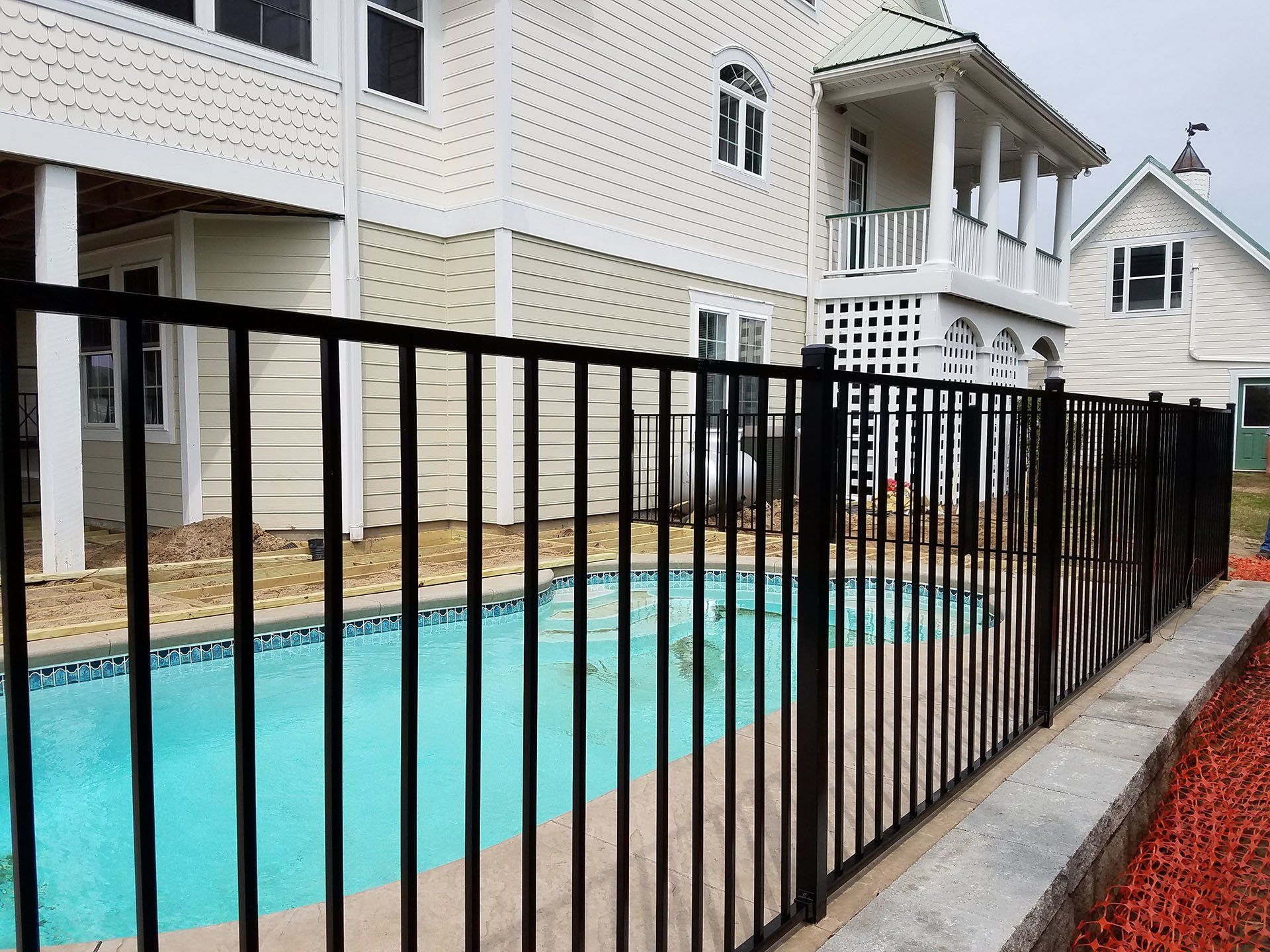House Pool With Black Fence — Wilmington,  NC — J & J Fence