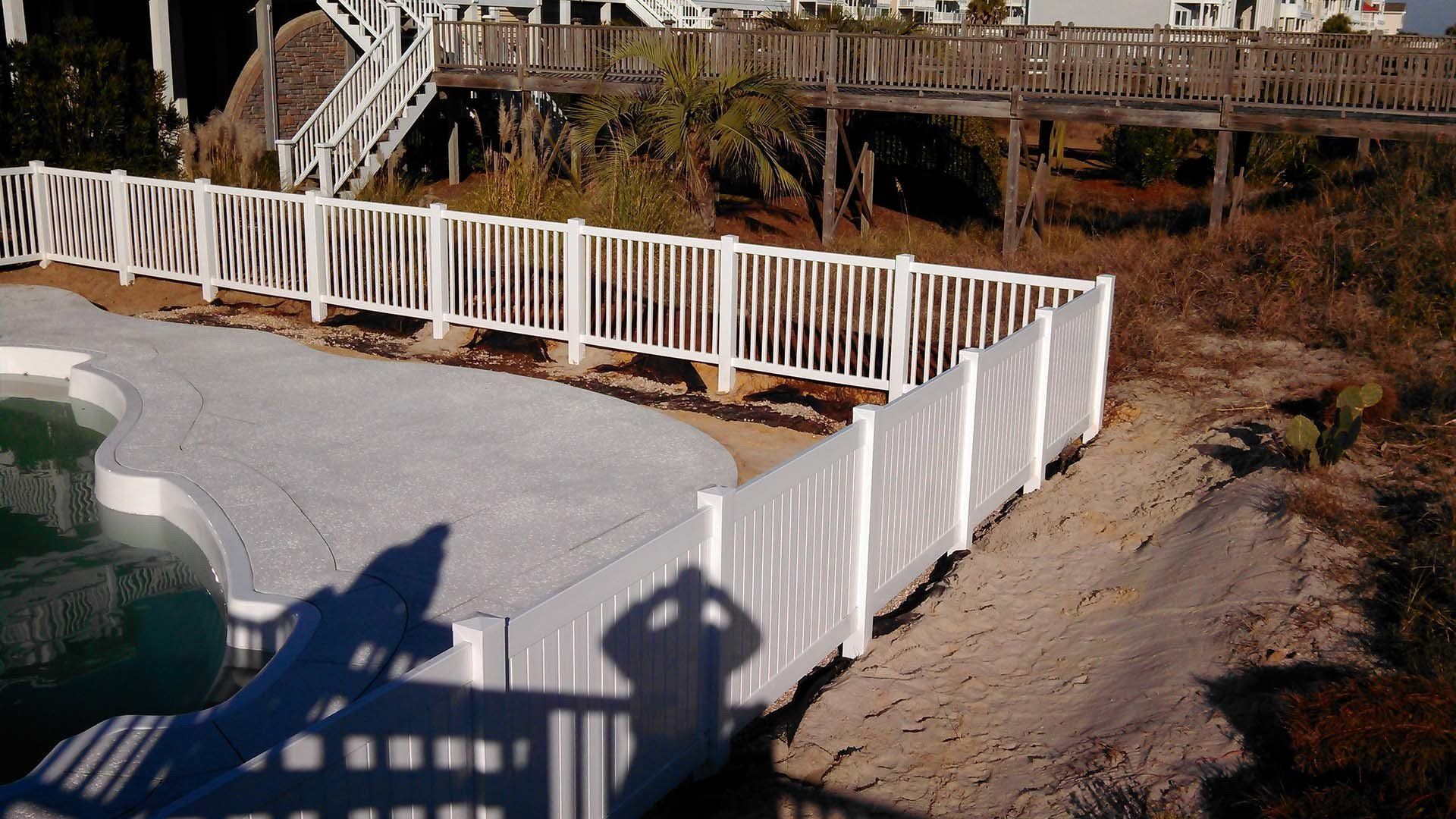 White Vinyl Pool Fence — Wilmington,  NC — J & J Fence
