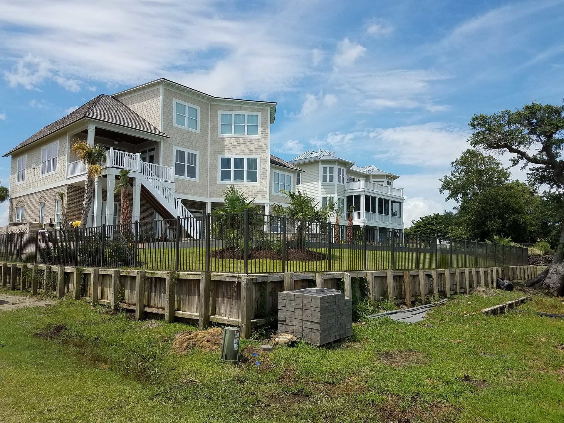 Elegant House With Aluminum Fence — Wilmington,  NC — J & J Fence