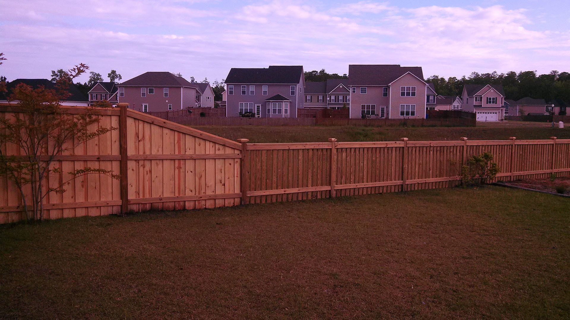 Houses And Wooden Fence — Wilmington,  NC — J & J Fence