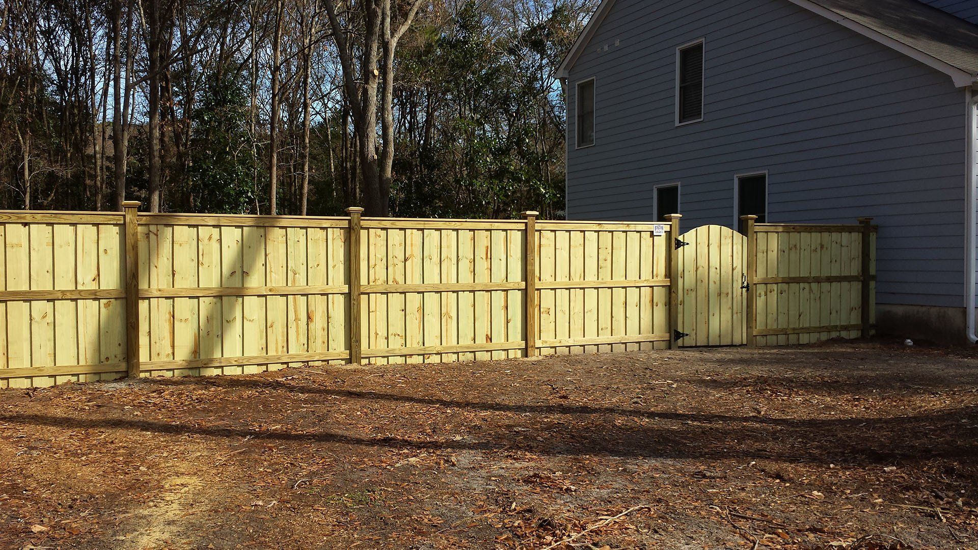 Backyard Wooden Fence — Wilmington,  NC — J & J Fence