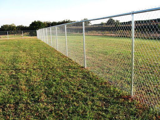 Fence On Grass — Wilmington,  NC — J & J Fence
