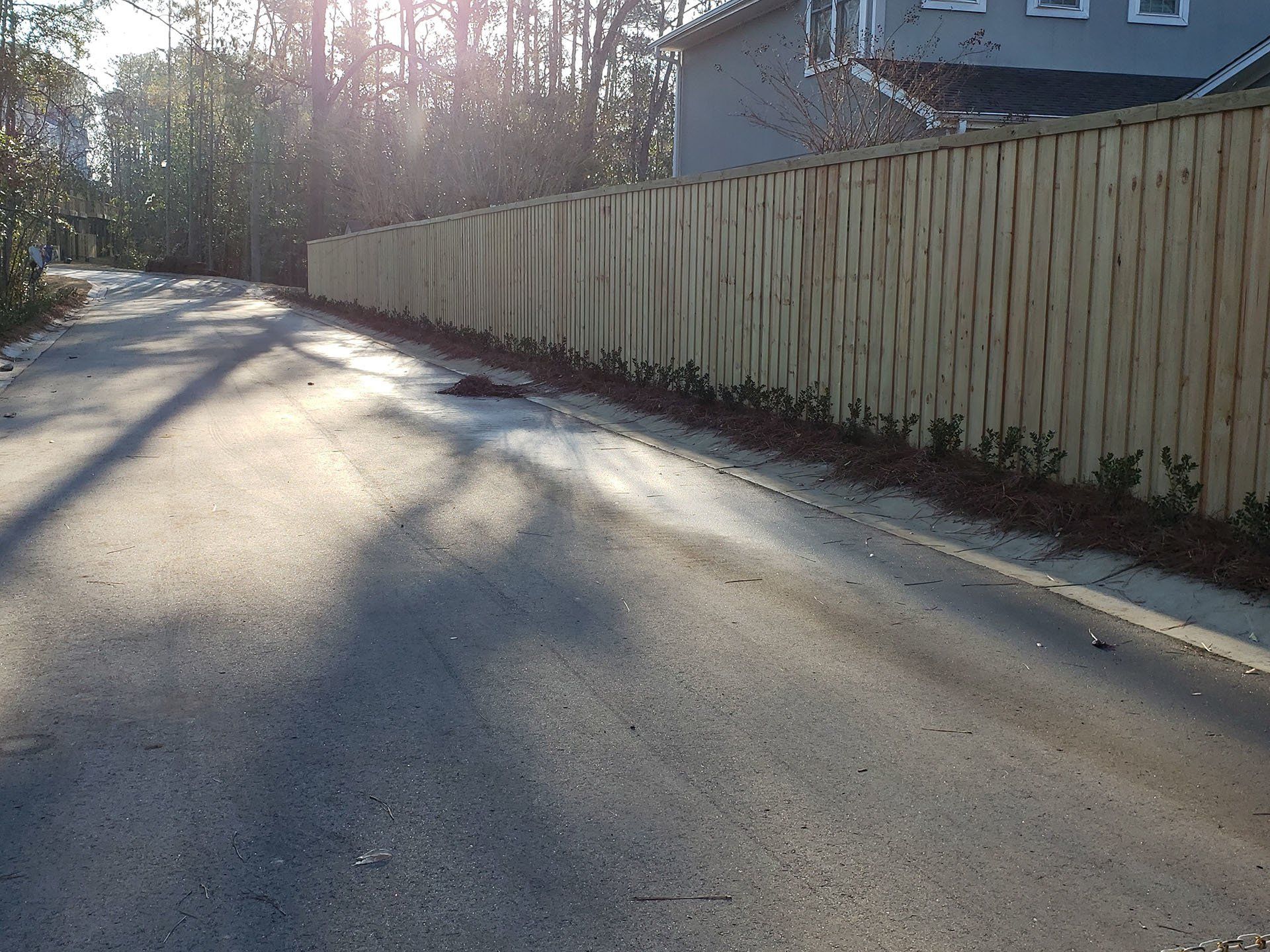 Wooden Fence Beside The Road — Wilmington,  NC — J & J Fence