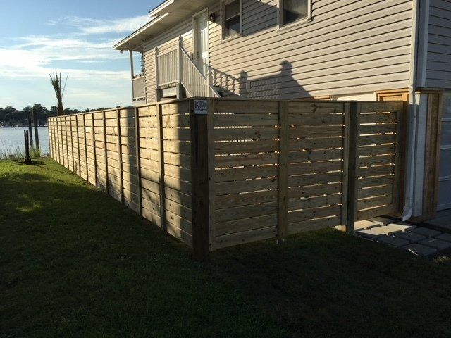 Backdoor Wooden Fence — Wilmington,  NC — J & J Fence