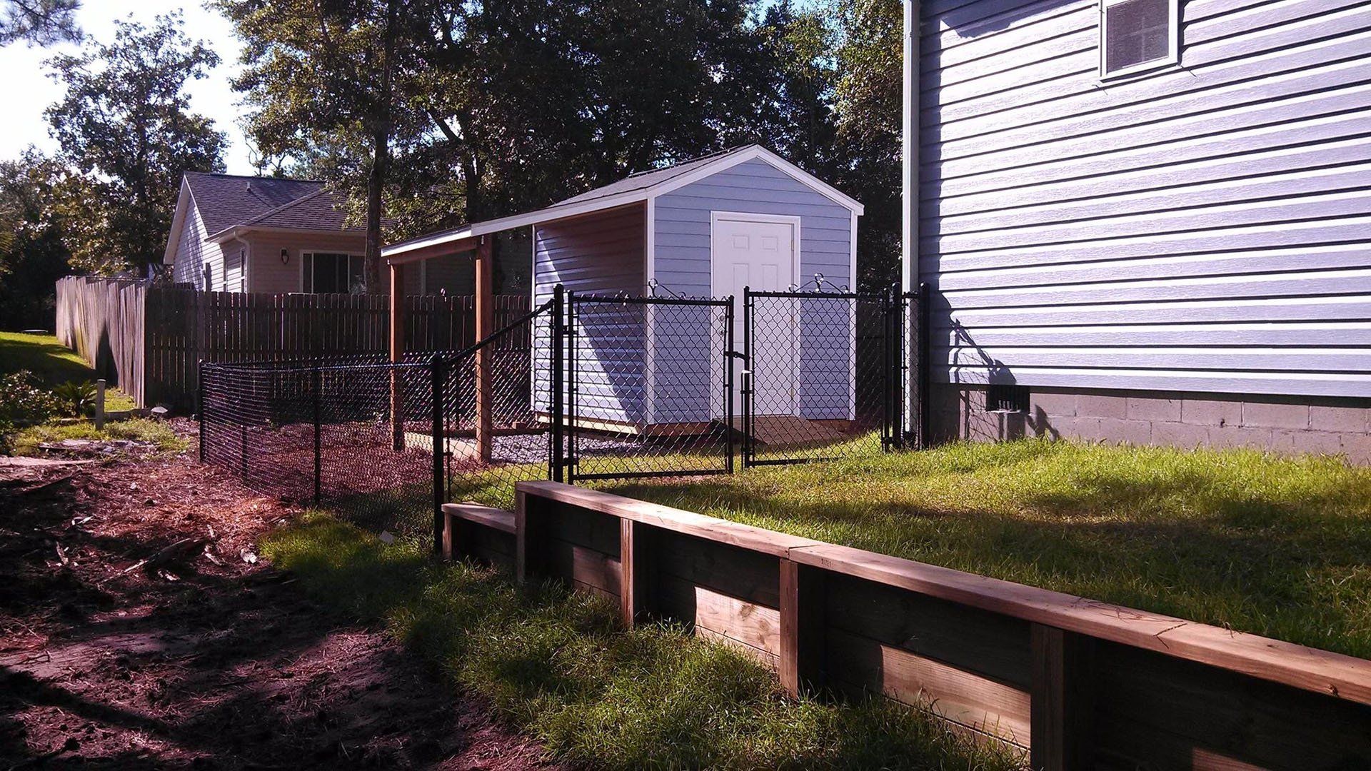 Gray House With Fence — Wilmington,  NC — J & J Fence