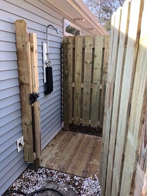 Backyard Shower With Wooden Fence — Wilmington,  NC — J & J Fence