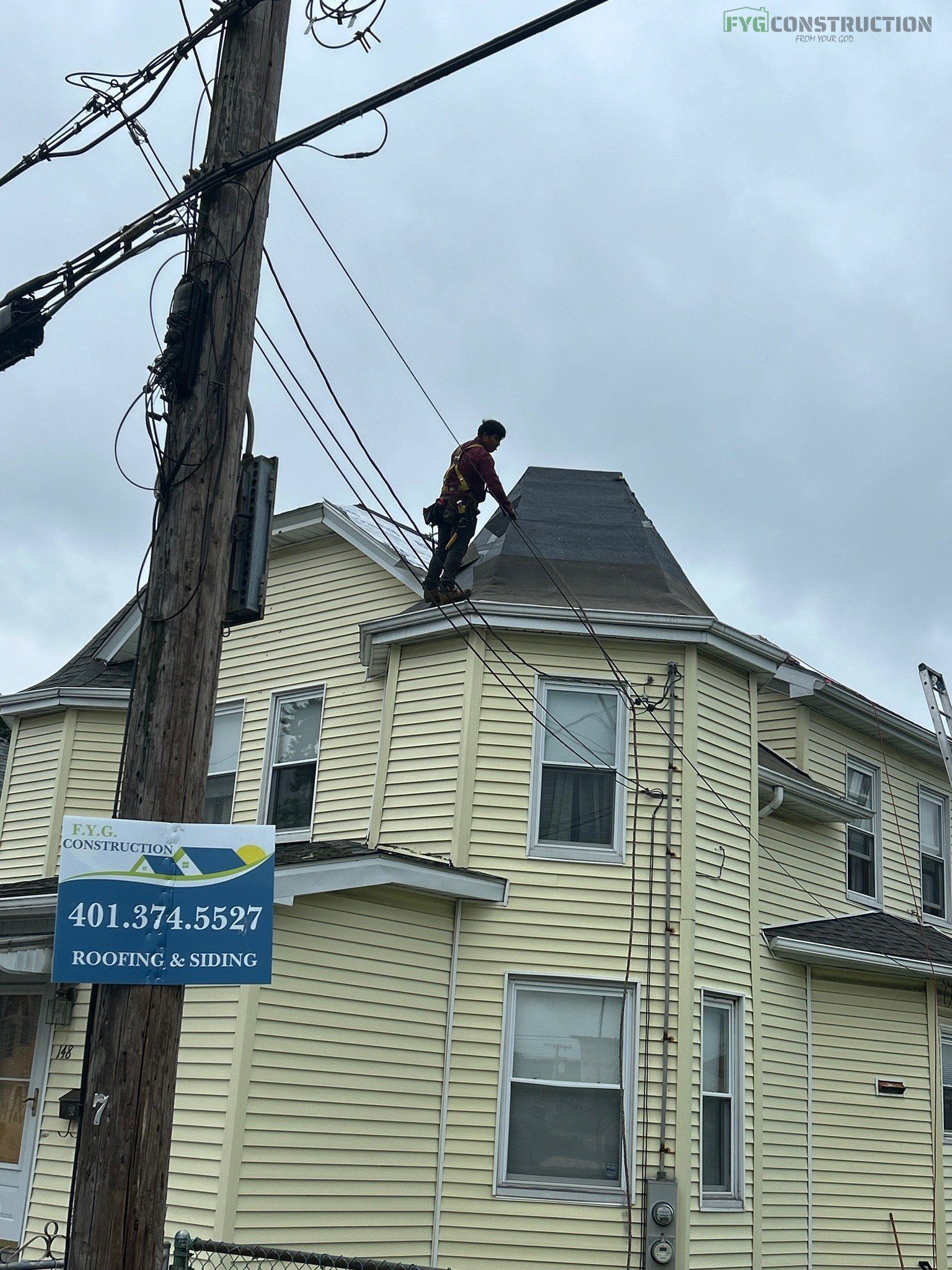 Roofers fixing roof shingles in Rhode Island
