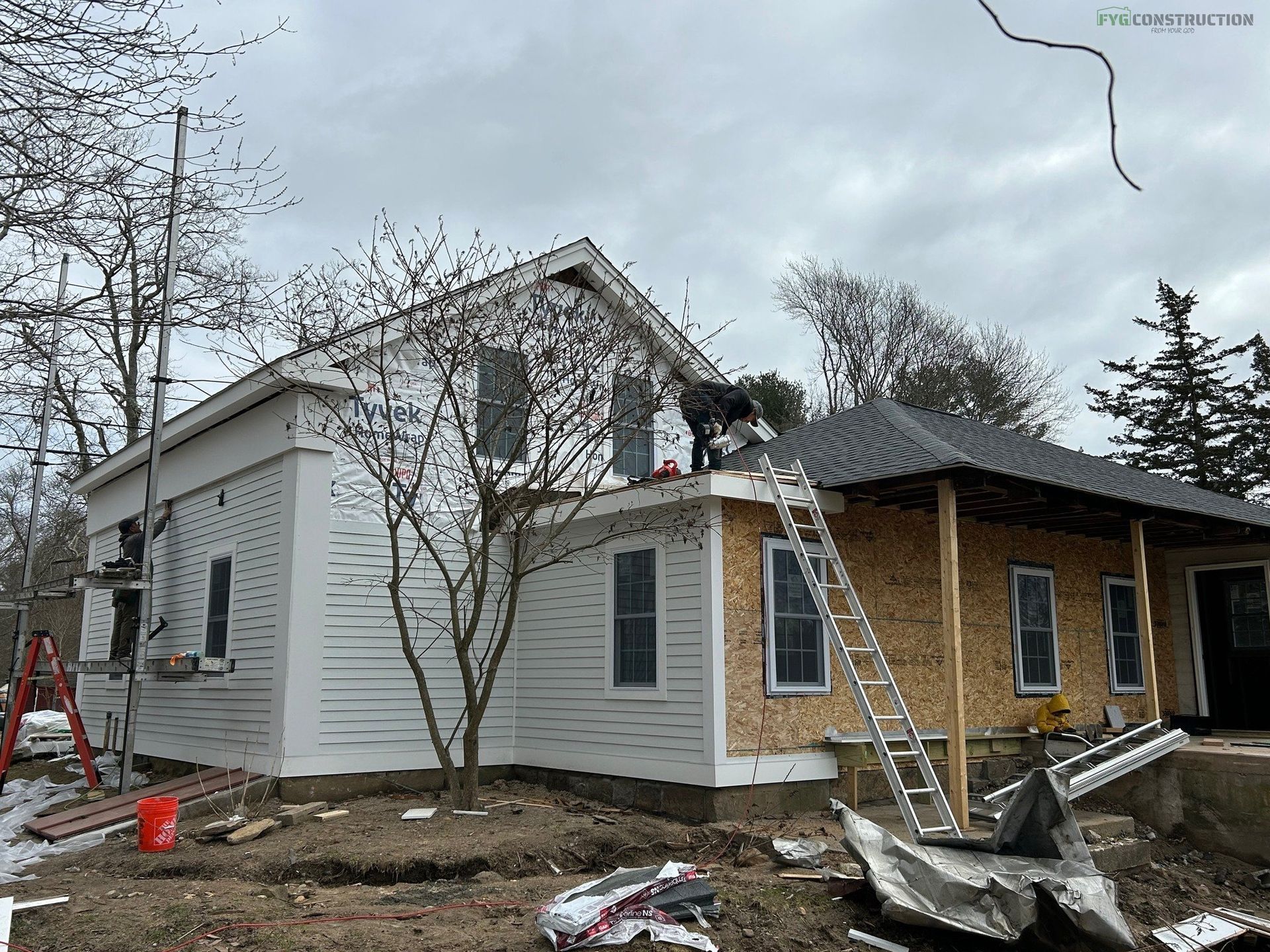 A South Kingstown roofer installing shingle roofing