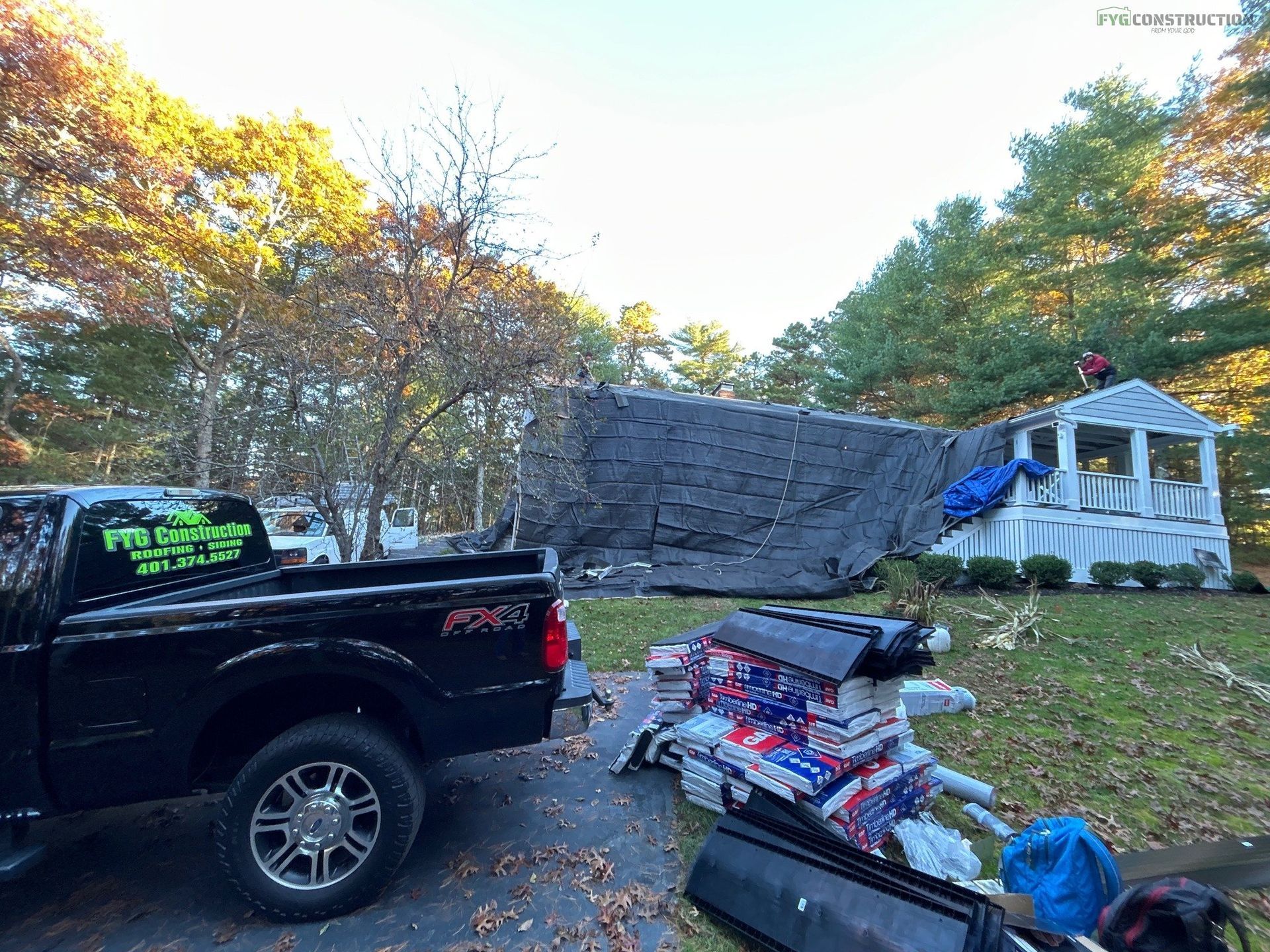 Roofers in South Kingstown completing job
