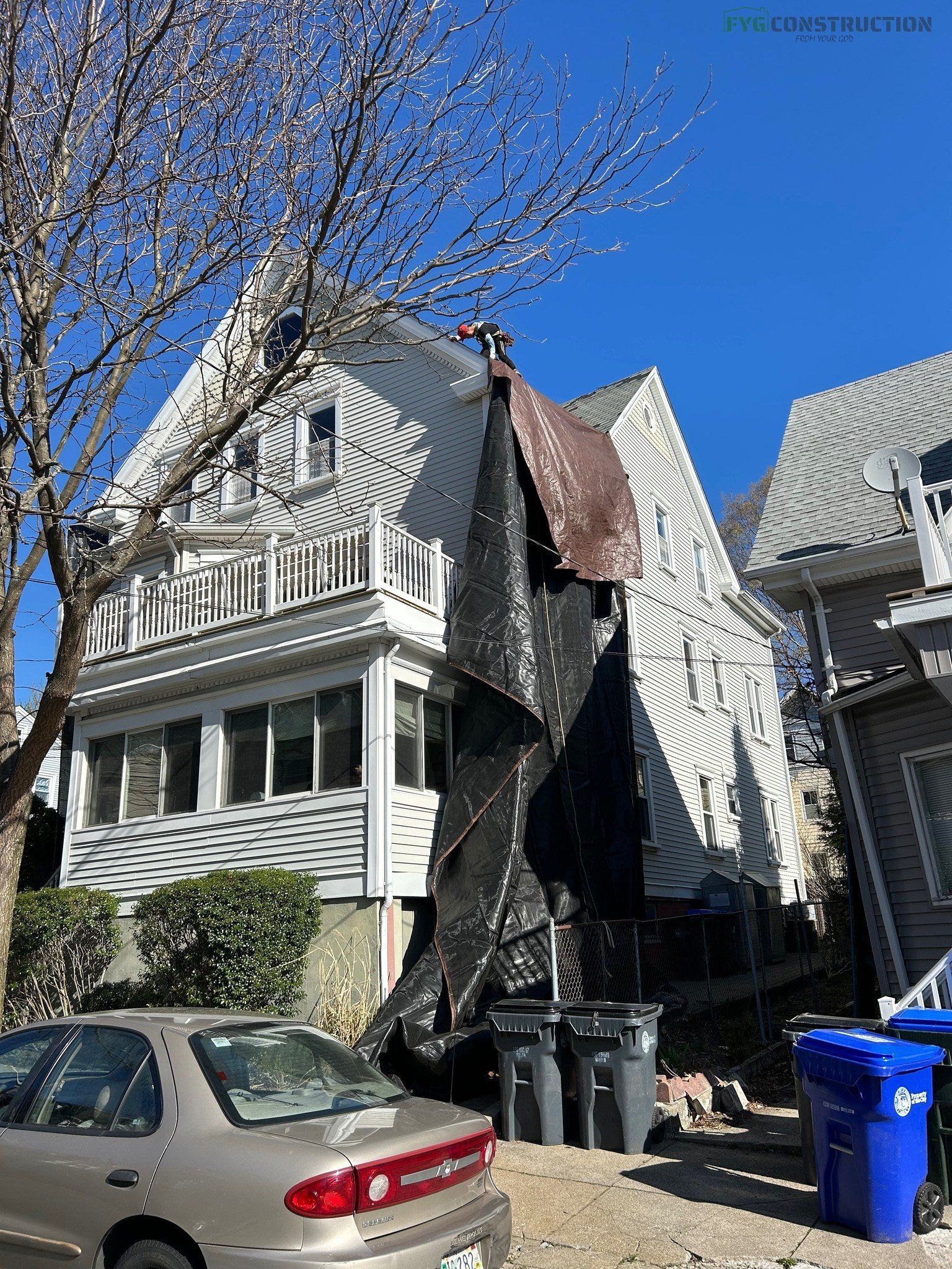 South Kingstown contractors working on roof