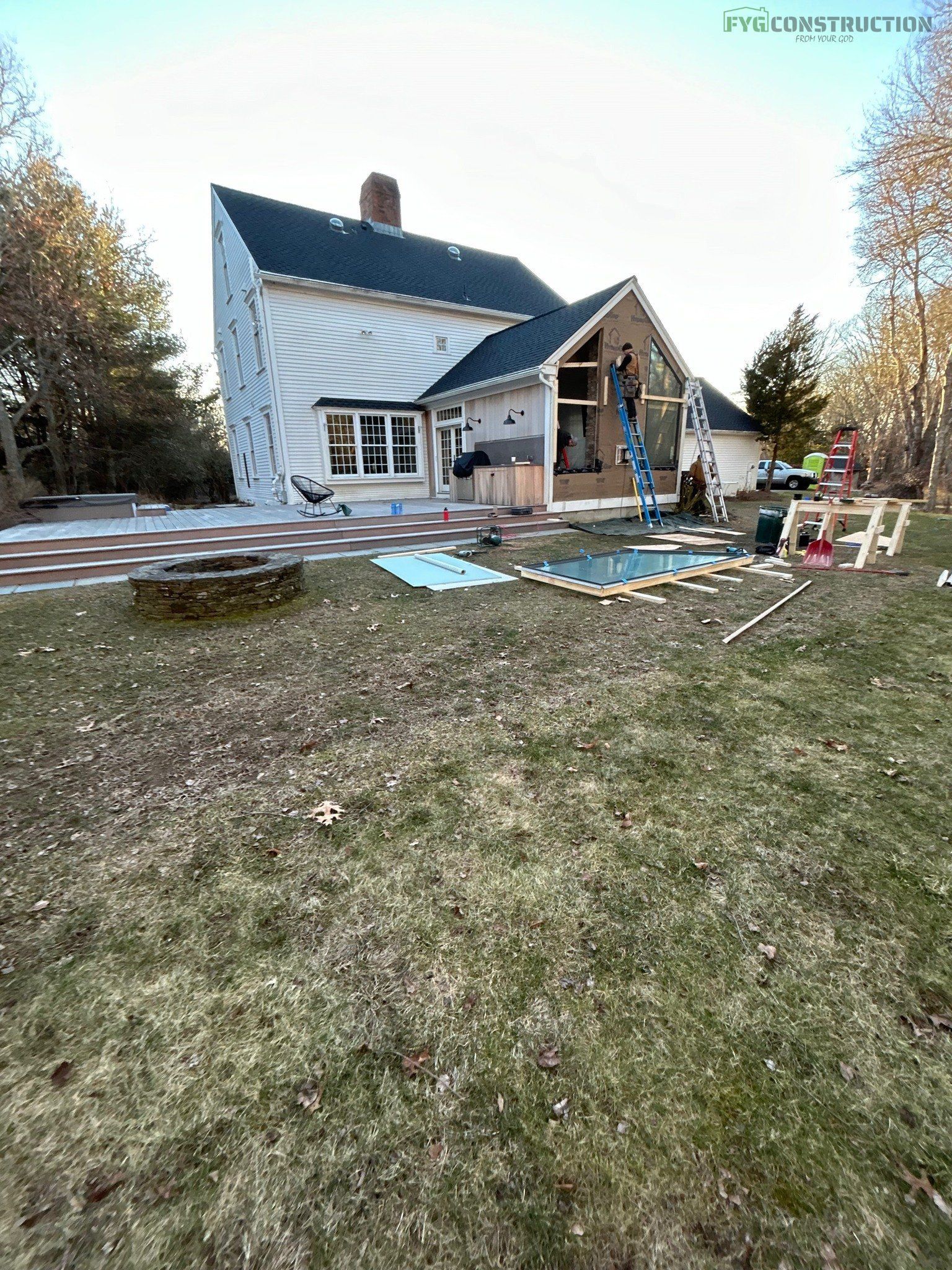 Roofing crew placing shingles