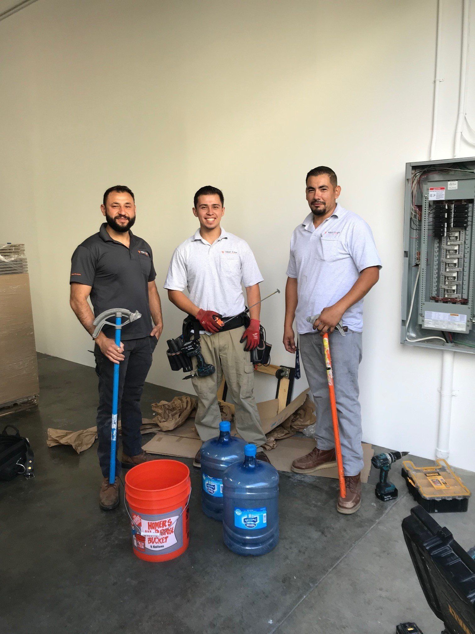 Electricians Holding Tools — Riverside, CA — Volt Tech Electric